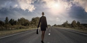 Business women walking down road